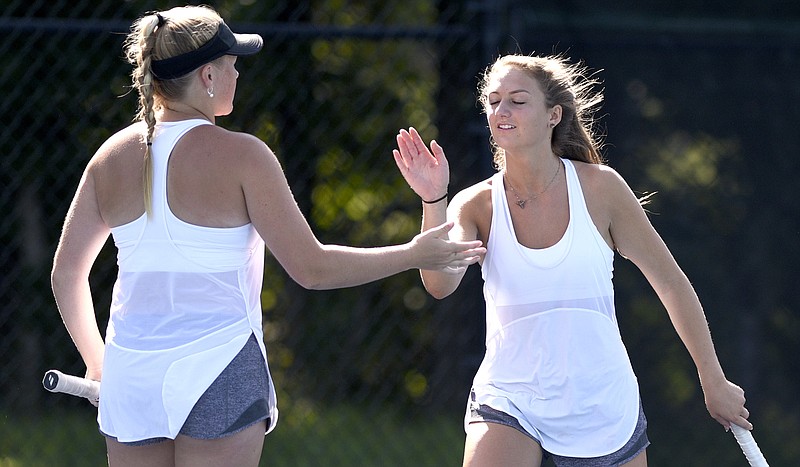 From left, Baylor doubles partners, Presley Thomas and Landie McBrayer celebrate a point of Baylor teammates Lauren Carelli and Lily Mooney.  The two Baylor doubles parenters competed in the finals of the TSSAA Spring Fling tennis tournament at the Adams Tennis Complex in Murfreesboro, Tenn. on May 25, 2018.