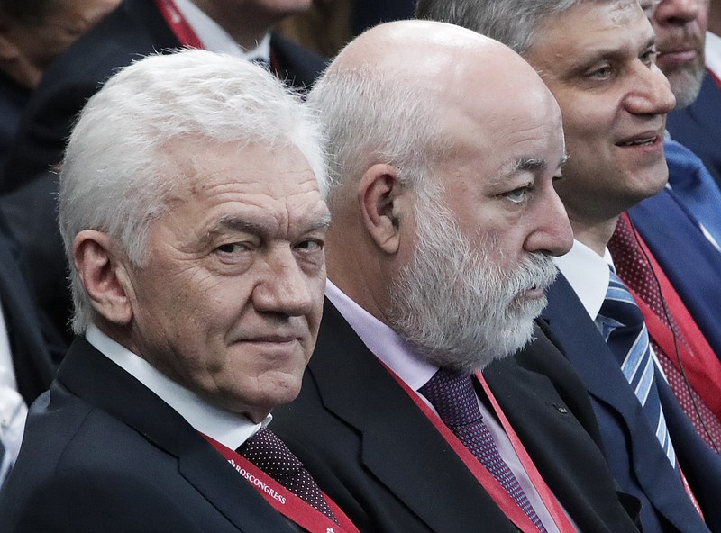 
              Co-owner of Novatek company Gennady Timchenko, left, and Renova CEO businessman Viktor Vekselberg, second right, attend the St. Petersburg International Economic Forum in St. Petersburg, Russia, Friday, May 25, 2018. (AP Photo/Dmitri Lovetsky, Pool)
            