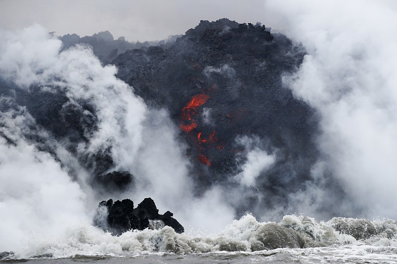 Lava entered the ocean from a third flow, marking the third week of a Hawaii volcano eruption that has opened up nearly two dozen vents in rural communities, destroyed dozens of buildings and shot miles-high plumes of ash into the sky.