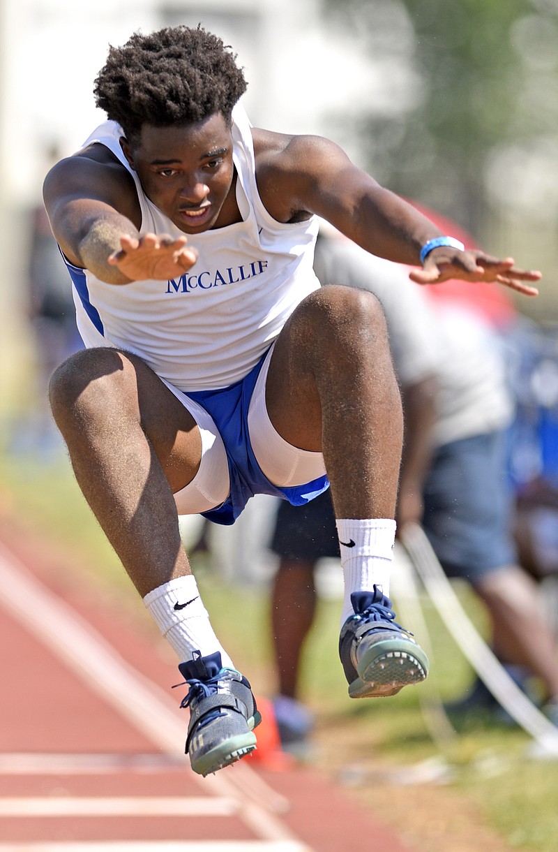 McCallie's Aaron Bastian competes in the triple jump Friday in the Spring Fling Division II-AA track and field championships at MTSU's Dean Hayes Track Stadium in Murfreesboro.