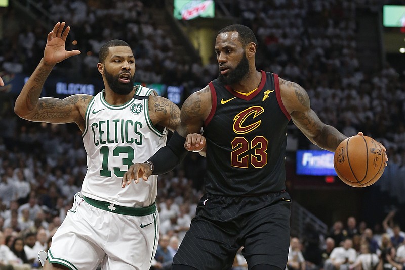 Cleveland Cavaliers' LeBron James (23) drives against Boston Celtics' Marcus Morris (13) during the first half of Game 6 of the NBA basketball Eastern Conference finals Friday, May 25, 2018, in Cleveland. (AP Photo/Ron Schwane)