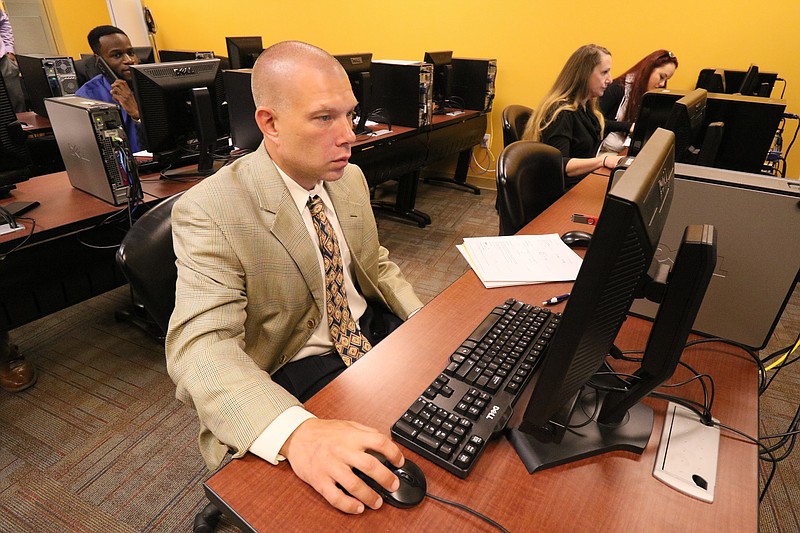 Matthew Landis fills out online applications during the New Life Job Fair on on April 28, 2017 at the Southeast Tennessee Career Center.