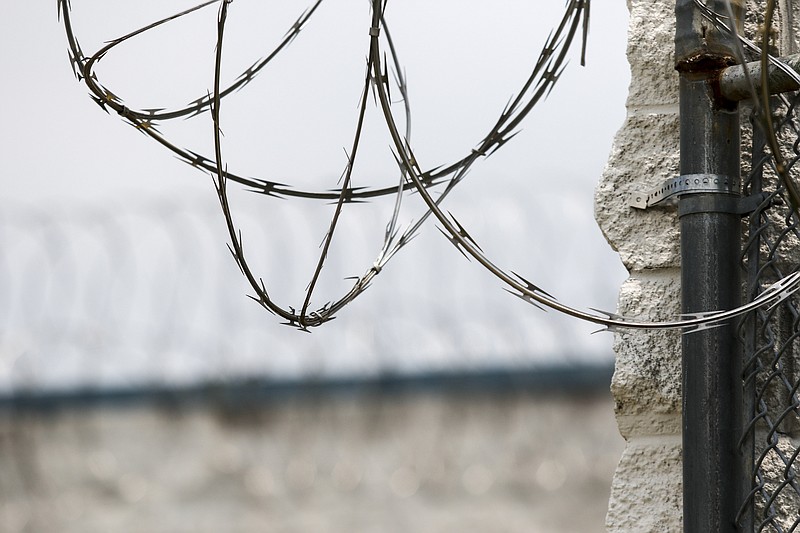 Razor wire tops a barrier fence on June 30, 2015, at Silverdale Correctional Facility in Chattanooga.