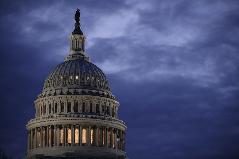 In this March 30, 2017, file photo, the Capitol Dome is seen at dawn in Washington. The Senate has kicked off its annual attempt to pass government funding bills. Success is hardly assured, but President Donald Trump has warned Congress that he will never sign another foot-tall, $1 trillion-plus government-wide spending bill, and he insists that he'll get full funding for his border wall. (AP Photo/J. Scott Applewhite, File)