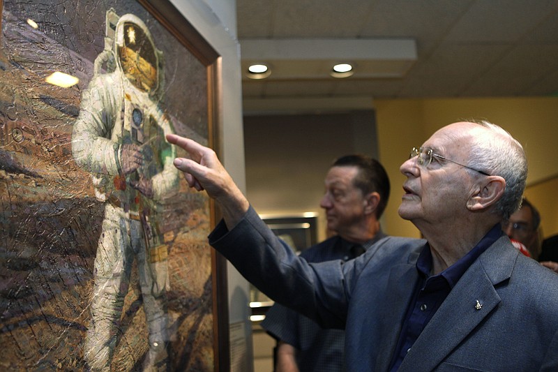  In this July 15, 2009 file photo, Apollo 12 astronaut Alan Bean walks through the largest exhibition of his artwork to date, inspired by his experience walking on the moon, to celebrate the 40th anniversary of the first Apollo moon landing, in Washington. Bean, the Apollo and Skylab astronaut, fourth human to walk on the moon and an accomplished artist, has died. Bean, 86, died on Saturday, May 26, 2018 at Houston Methodist Hospital in Houston. (AP Photo/Jacquelyn Martin, File)