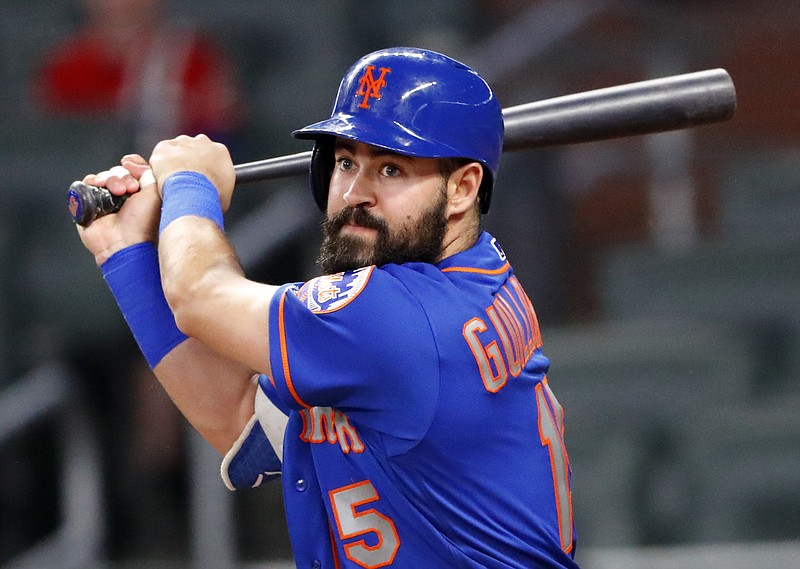 New York Mets shortstop Luis Guillorme (15) drives in a run with a base hit in the seventh inning of the second game of a baseball doubleheader against the Atlanta Braves, Tuesday, May 29, 2018, in Atlanta. (AP Photo/John Bazemore)