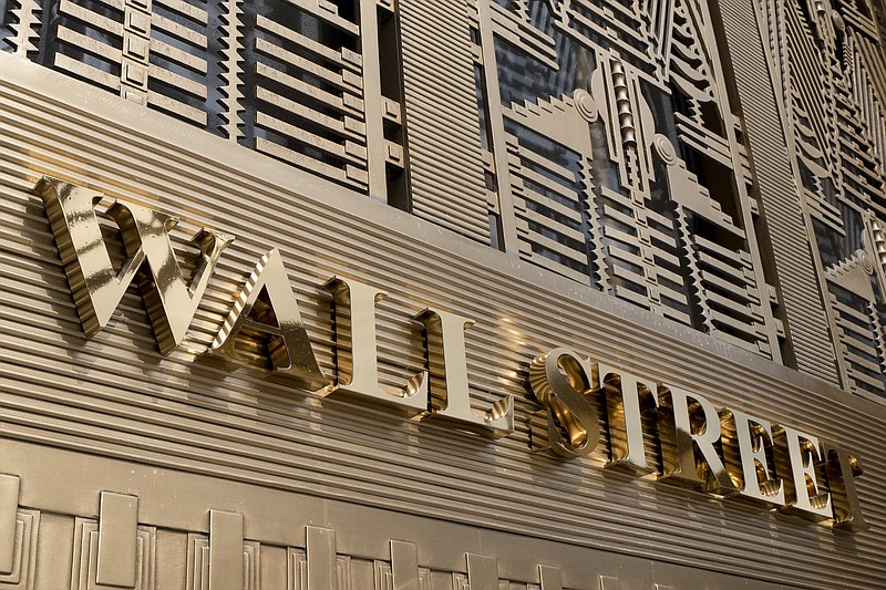 FILE- In this April 24, 2018, file photo, a sign for a Wall Street building is shown in New York. The U.S. stock market opens at 9:30 a.m. EDT on Wednesday, May 30. (AP Photo/Mark Lennihan, File)