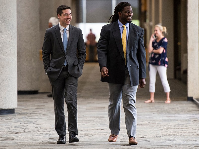 Former University of Tennessee linebacker A.J. Johnson, right, walks to the courtroom in Knox County Criminal Court on Wednesday, May 30, 2018. (Photo: Brianna Paciorka/News Sentinel)
