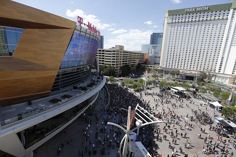 
              Fans arrive for Game 2 of the NHL hockey Stanley Cup Finals between the Vegas Golden Knights and the Washington Capitals on Wednesday, May 30, 2018, in Las Vegas. (AP Photo/Ross D. Franklin)
            