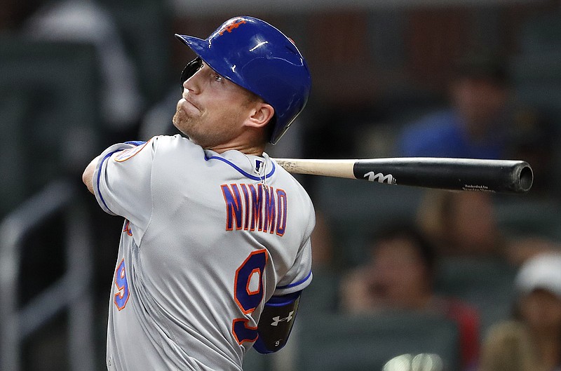 New York Mets' Brandon Nimmo (9) drives in a run with a base hit in the seventh inning of a baseball game against the Atlanta Braves on Wednesday, May 30, 2018, in Atlanta. (AP Photo/John Bazemore)
