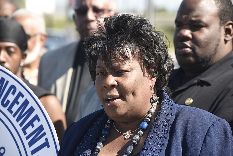 Dr. Elenora Woods, president of the Chattanooga-Hamilton County NAACP, speaks at a news conference on the sidewalk in front of the East Lake Courts on Tuesday, Sept. 15, 2015, in Chattanooga, Tenn.