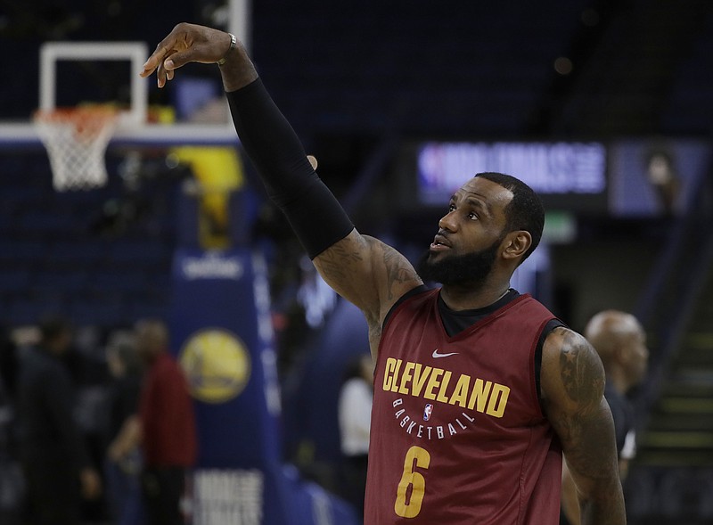 Cleveland Cavaliers' LeBron James follows through on a shot during an NBA basketball practice, Wednesday, May 30, 2018, in Oakland, Calif. The Cavaliers face the Golden State Warriors in Game 1 of the NBA Finals on Thursday in Oakland. (AP Photo/Marcio Jose Sanchez)