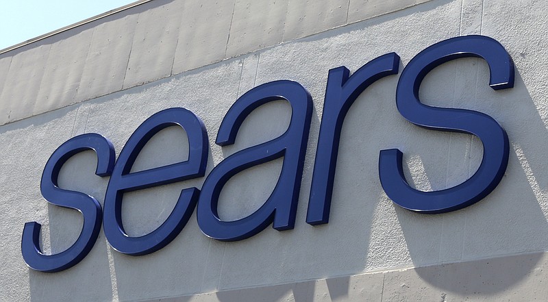 FILE - This May 11, 2017 file photo shows a Sears store in Hialeah, Fla.  Sears is closing another 72 stores after reporting a first-quarter losses and plunging sales. The struggling retailer said Thursday, May 31, 2018 that it has identified about 100 stores that are no longer turning profits, and 72 of those locations will be shuttered soon.  (AP Photo/Alan Diaz, File)