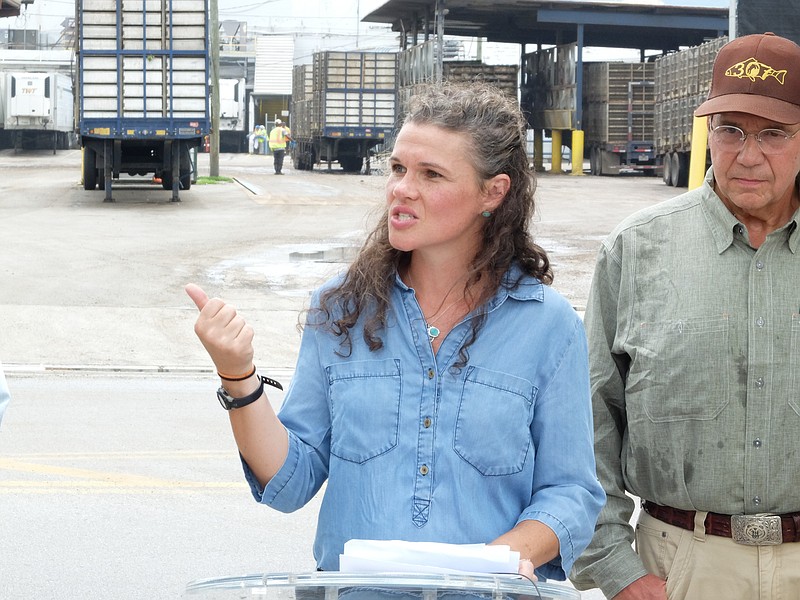Ruth Almeter speaks alongside Blackwell Smith, longtime resident and business owner in Walker County, about not wanting a Pilgrims Pride chicken plant in McLemore Cove Thursday outside the 1591 Broad Street plant in Chattanooga.