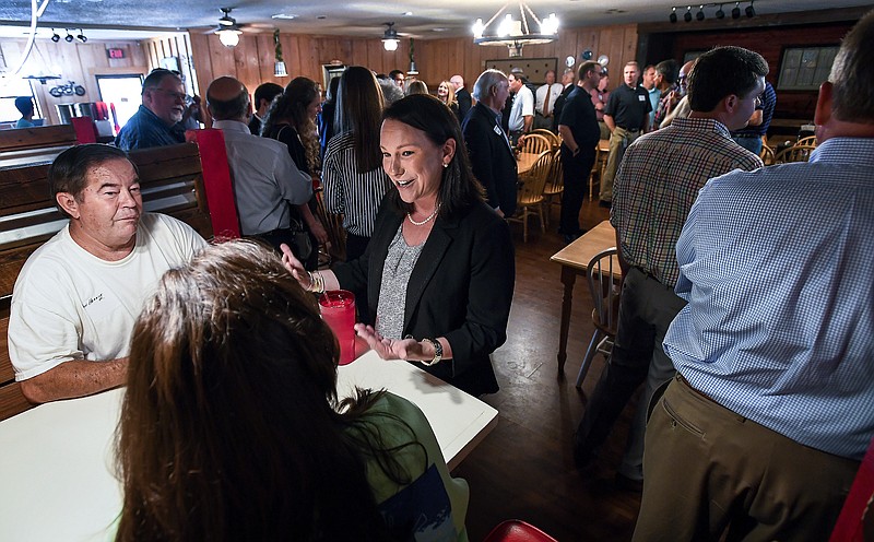 U.S. Representative Martha Roby meets with locals during a fish fry in Andalusia, Ala., on Wednesday, May 30, 2018, while campaigning for re-election in south Alabama. (Mickey Welsh /The Montgomery Advertiser via AP)