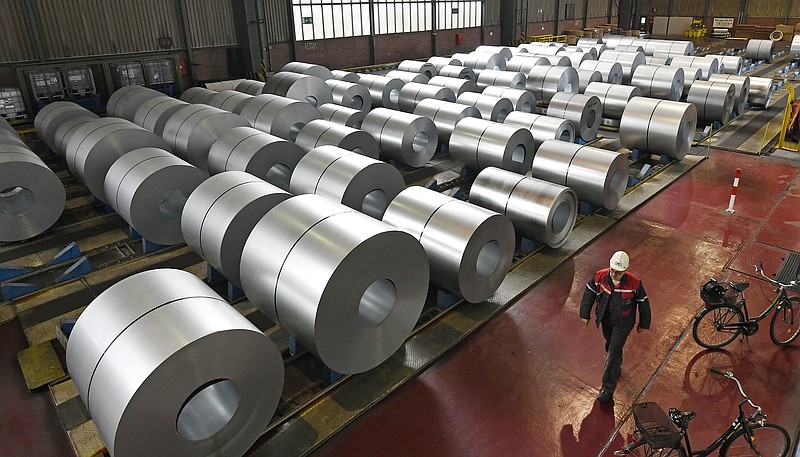 FILE - In this April 27, 2018 photo steel coils are stored at the Thyssenkrupp steel factory in Duisburg, Germany. (AP Photo/Martin Meissner, file)

