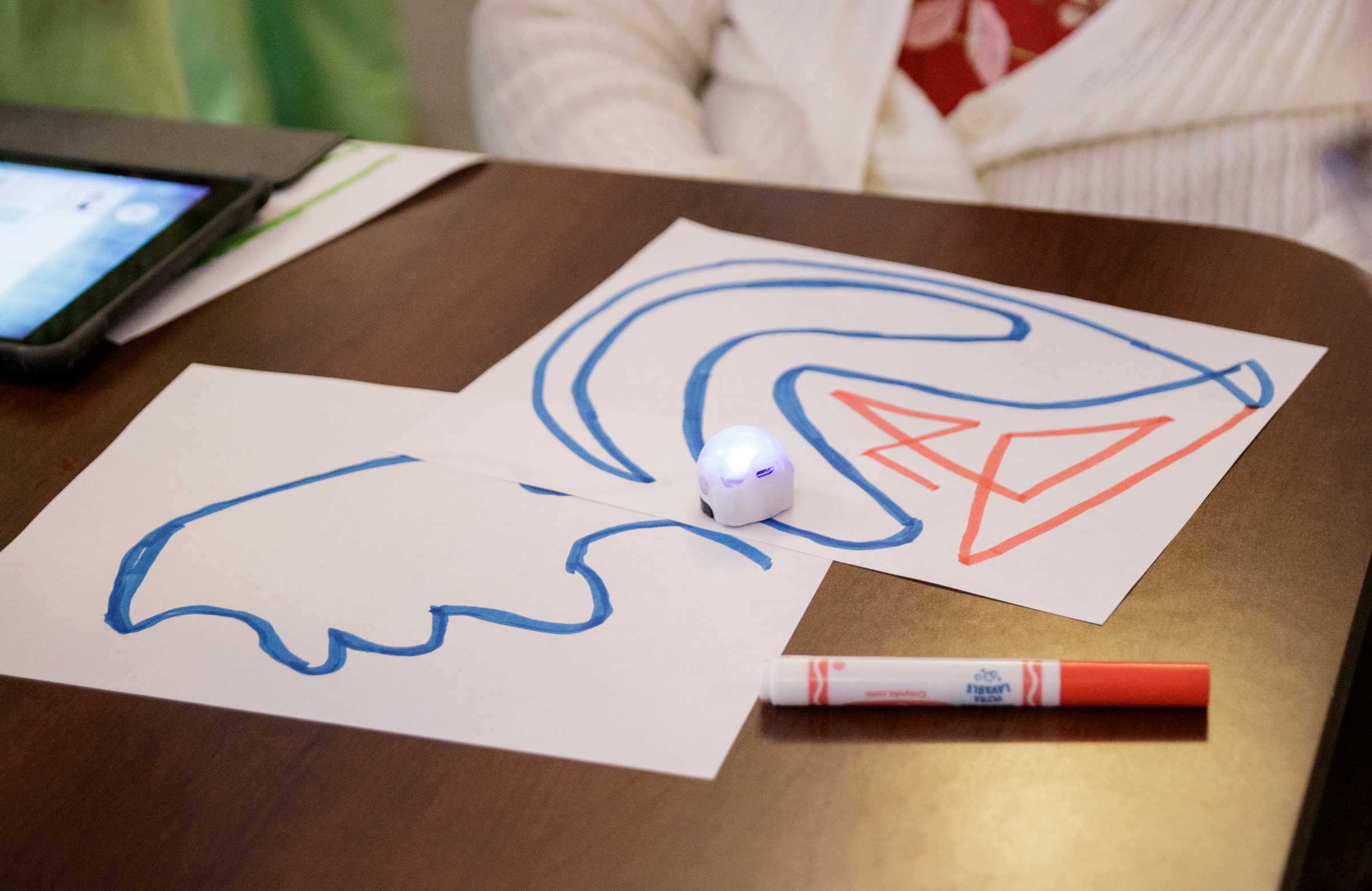 An ozobot robot follows a traced line during a student demonstration at Life Care Center of Red Bank on Tuesday, May 15, 2018, in Red Bank, Tenn. Teacher Beth Wilson takes her class for active learning activities at the senior care facility.