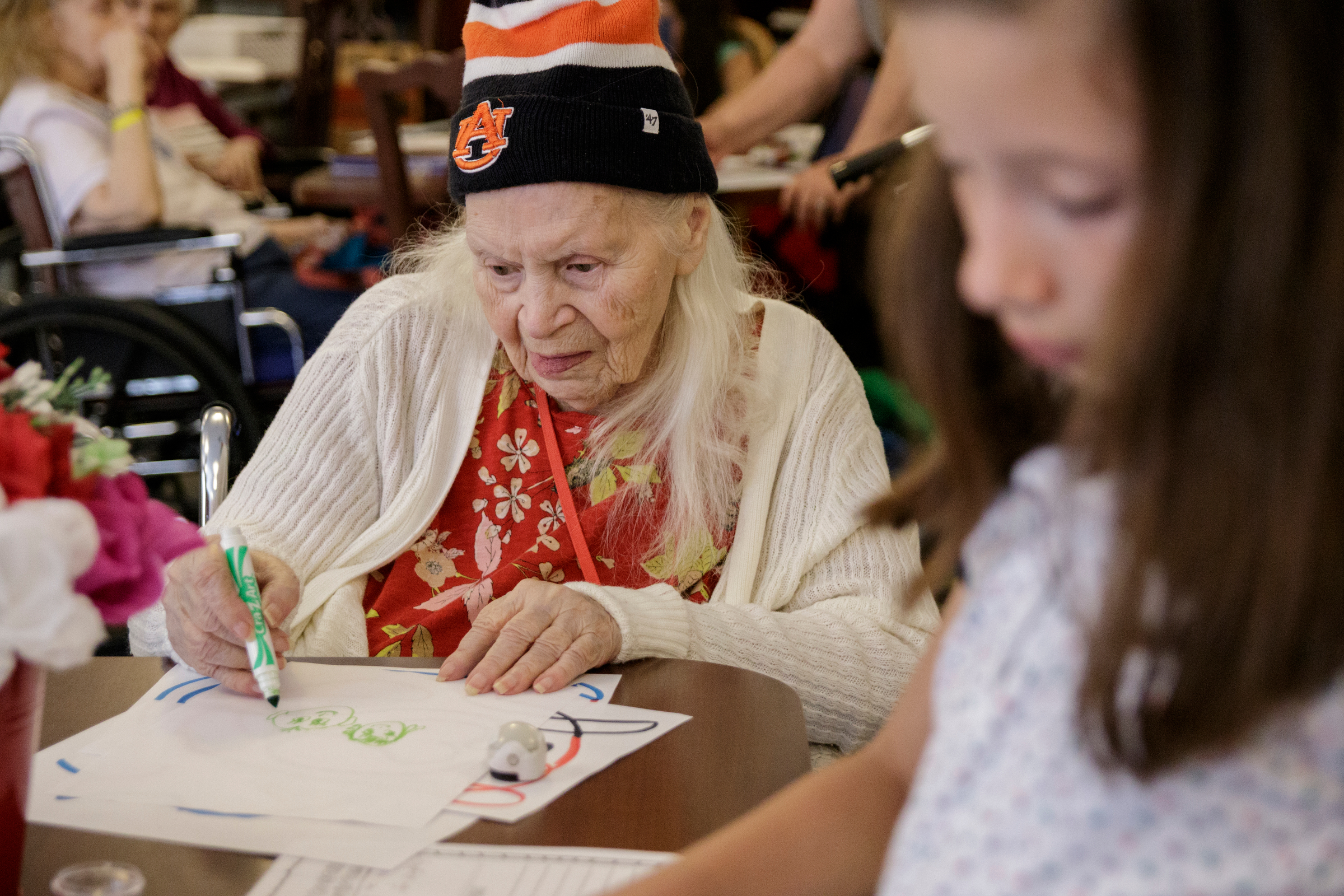 Sarah Swann draws for visiting students at Life Care Center of Red Bank on Tuesday, May 15, 2018, in Red Bank, Tenn. Teacher Beth Wilson takes her class for active learning activities at the senior care facility.