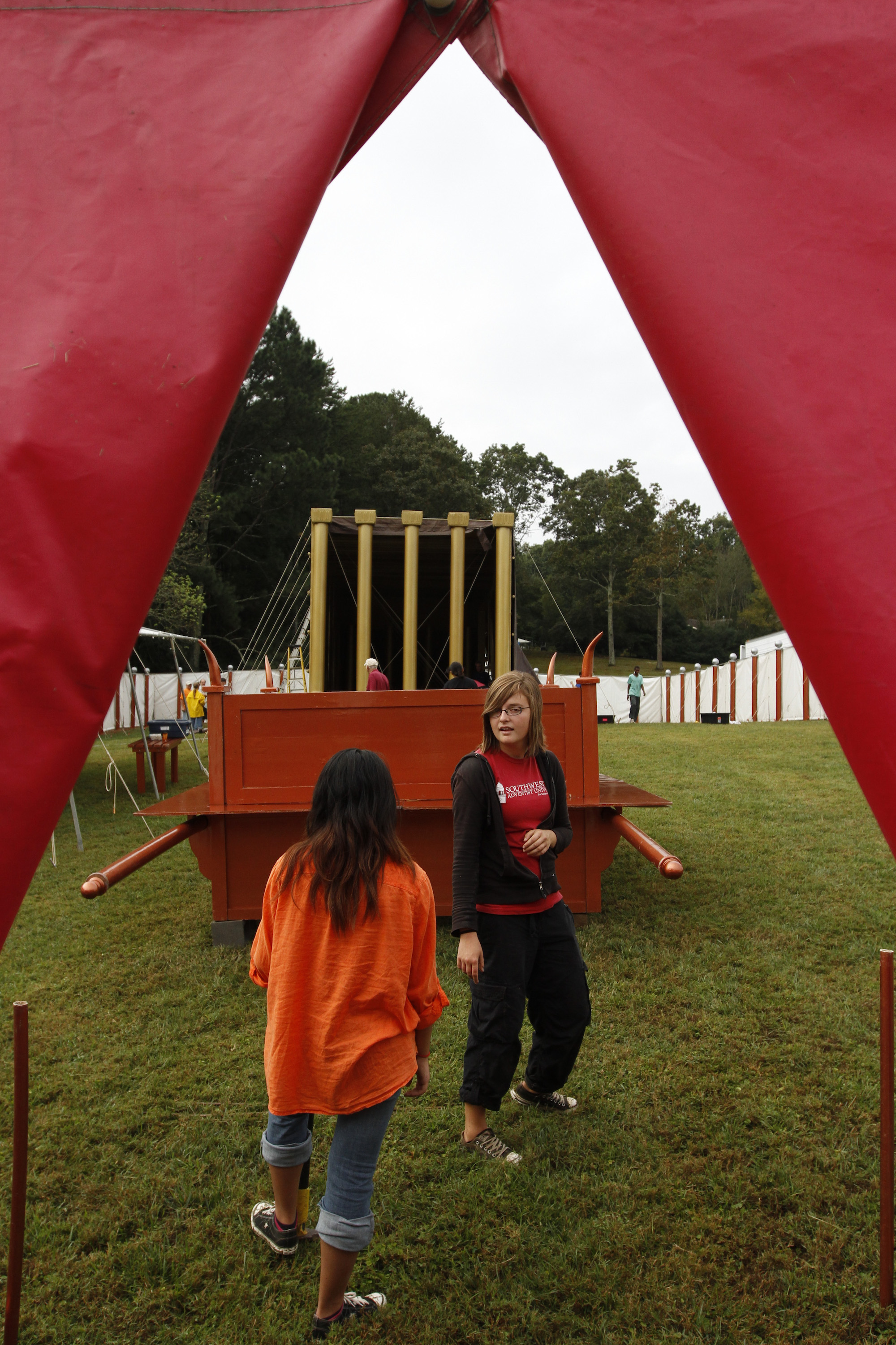 Oklahoma residents Janice Bongcayao, left, and Savannah Smith work on the construction of a Messiah's Mansion replica during its setup in Chattanooga in 2013.