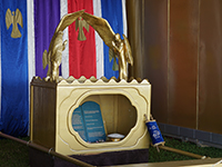 The ark was made of shittim wood overlaid with gold. It was 2.5 cubits (3.75 feet) long, 1.5 cubits (2.25 feet) wide and 1.5 cubits (2.25 feet) tall. It had a crown around it and four rings, one in each corner, for the staves that were used to carry it. The lid to the ark was the mercy seat, a solid piece of gold the same dimensions as the top of the ark. On top of the mercy seat, on either side, were angels made of pure beaten gold. (Exodus 25:10-20)