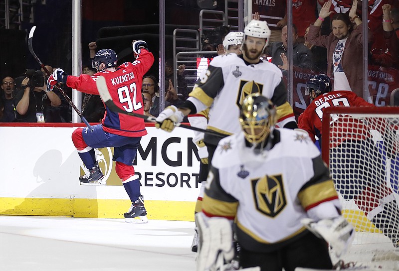 Washington Capitals forward Evgeny Kuznetsov, back left, of Russia, celebrates his goal against Vegas Golden Knights goaltender Marc-Andre Fleury, front right, during the second period in Game 3 of the NHL hockey Stanley Cup Final, Saturday, June 2, 2018, in Washington. (AP Photo/Alex Brandon)
