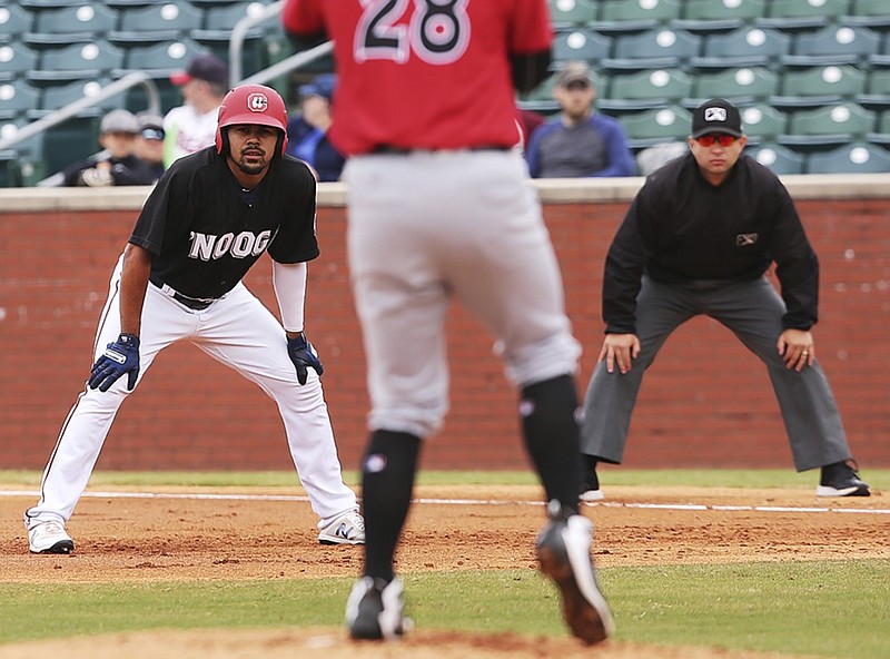 The Chattanooga Lookouts' LaMonte Wade leads off first base while watching Birmingham Barons pitcher Ian Clarkin during an April 8 game at AT&T Field. The Lookouts won there Sunday, beating the Mobile BayBears 13-5 to open a five-game series. Chattanooga leads the Southern League's North Division with 14 games remaining in the first half of the regular season.