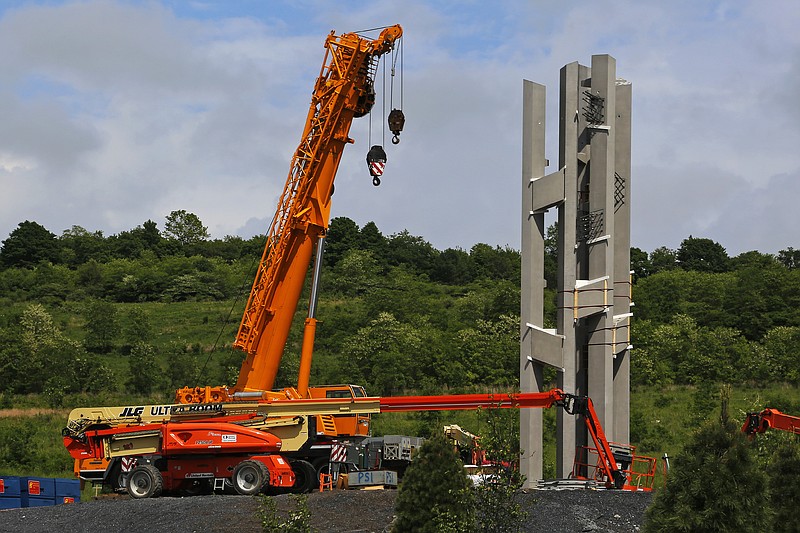 
              This May 31, 2018, photo shows the first section of the 93-foot tall Tower of Voices wind chimes is in place at the Flight 93 National Memorial in Shanksville, Pa. The final phase of the memorial is underway and on track to open on the 17th anniversary of plane's crash into a Pennsylvania field during 9/11. (AP Photo/Gene J. Puskar)
            