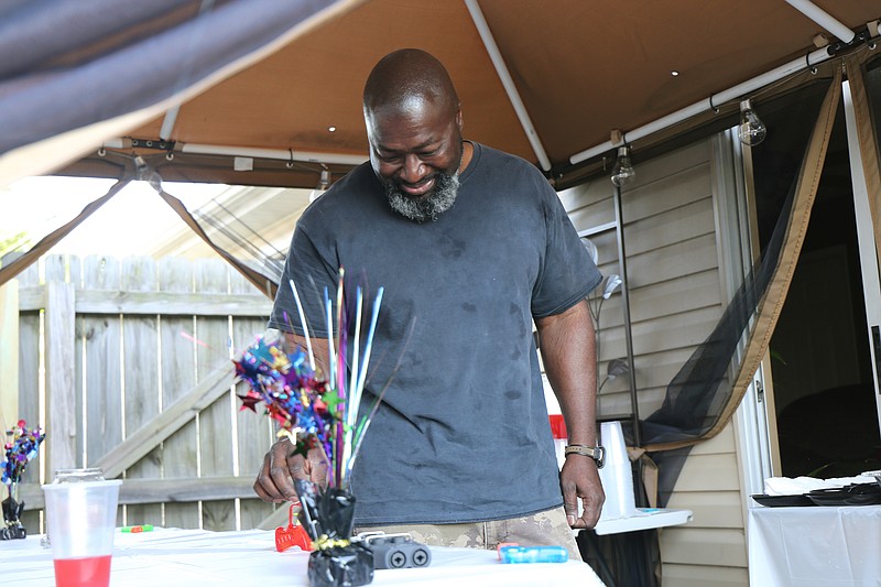 In this April 28, 2018, photo, Matthew Charles walks into a surprise gathering of friends and coworkers in his honor just weeks before his release, in Nashville, Tenn. (Julieta Martinelli/Nashville Public Radio via AP)