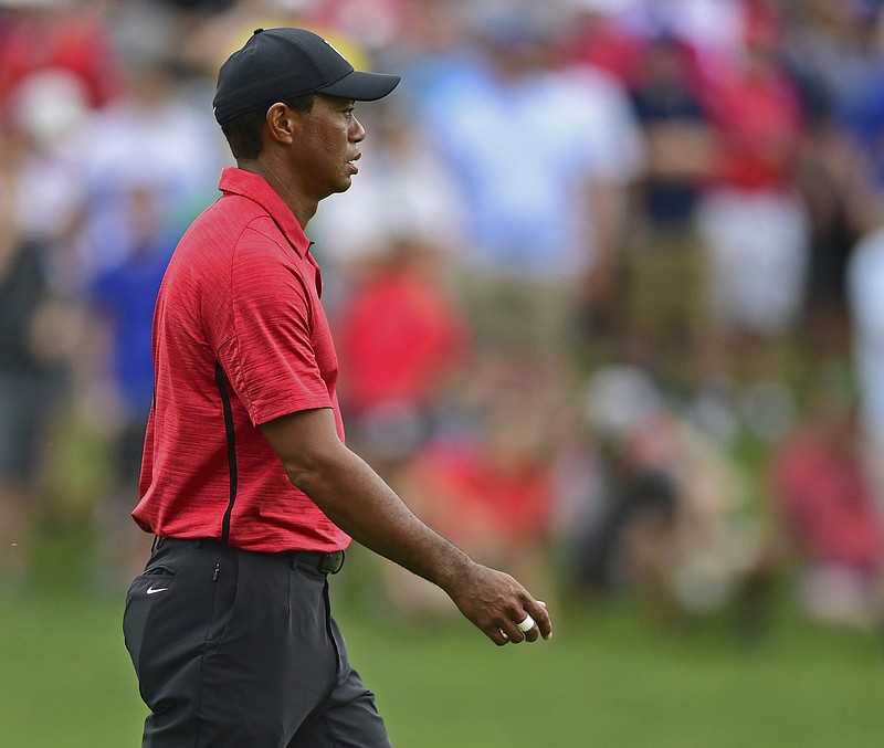 Tiger Woods walks to the green on the seventh hole during the final round of the Memorial golf tournament Sunday, June 3, 2018, in Dublin, Ohio. (AP Photo/David Dermer)