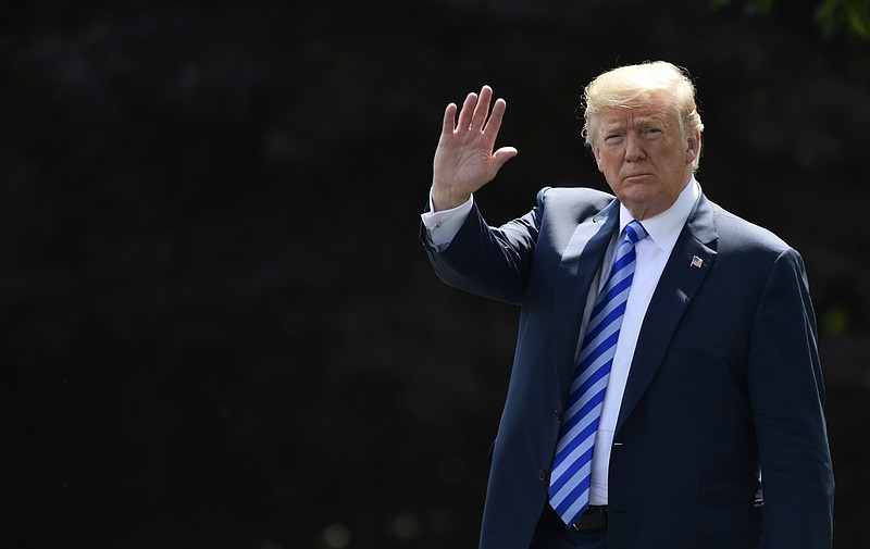 President Donald Trump walks from the Oval Office to Marine One on Friday. (AP Photo/Susan Walsh)