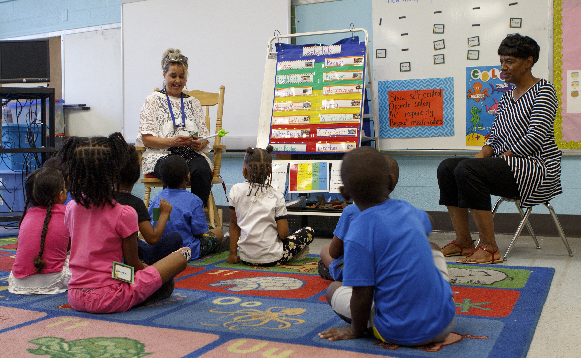 Pre-K teacher Ginger Varner, left, and assistant teacher Juanita Naylor go over the names of the students and teachers taking part in Camp K at Woodmore Elementary School on Monday, June 4, 2018 in Chattanooga, Tenn.