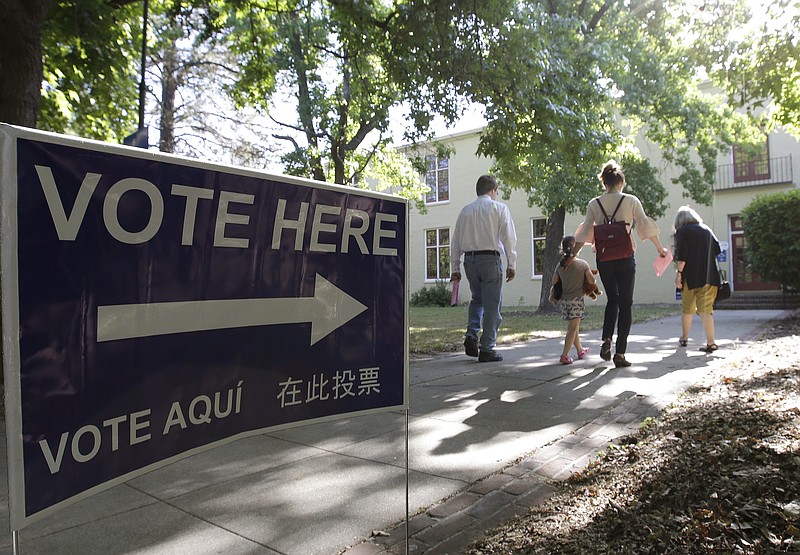Voters walk to a precinct place at the Sierra 2 Center for the Arts and Community to cast their ballots Tuesday, June 5, 2018, in Sacramento, Calif.