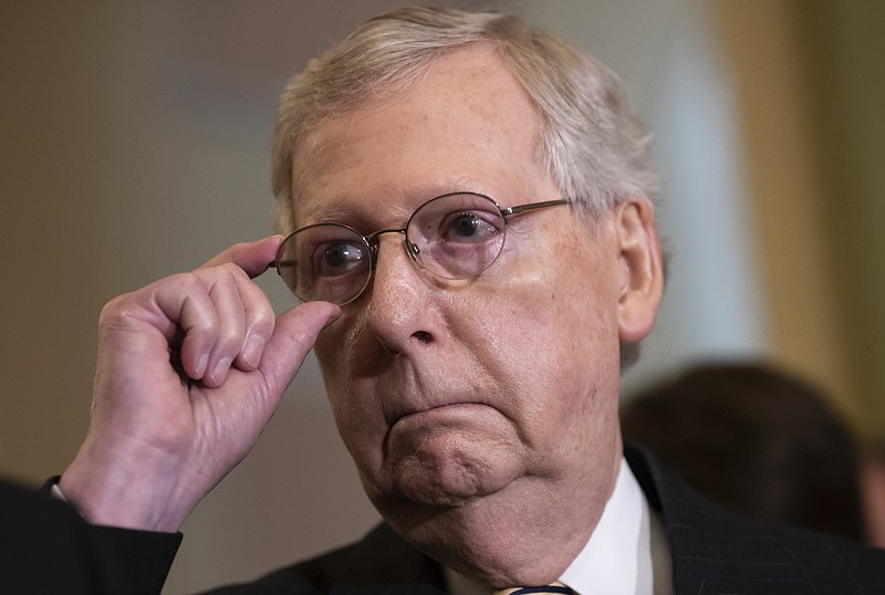 Senate Majority Leader Mitch McConnell, R-Ky., tells reporters he intends to cancel the traditional August recess and keep the Senate in session to deal with backlogged tasks, on Capitol Hill in Washington, Tuesday, June 5, 2018. (AP Photo/J. Scott Applewhite)