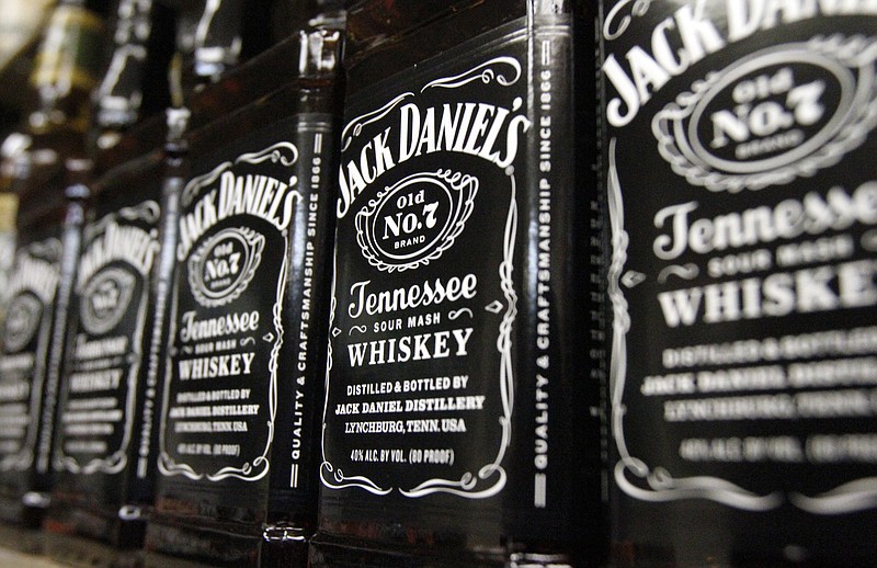 FILE - In this Dec. 5, 2011, file photo, bottles of Jack Daniel's Tennessee Whiskey line the shelves of a liquor outlet in Montpelier, Vt. Brown-Forman Corp. (BF.A) on Wednesday, June 6, 2018, reported fiscal fourth-quarter earnings of $110 million. (AP Photo/Toby Talbot, File)