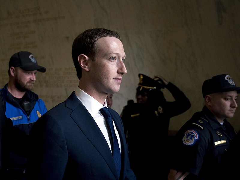 FILE - In this April 11, 2018, file photo, Facebook CEO Mark Zuckerberg departs after testifying before a House Energy and Commerce hearing on Capitol Hill in Washington about the use of Facebook data to target American voters in the 2016 election and data privacy. The New York Times says Facebook has acknowledged it shared user data with several Chinese handset manufacturers, including Huawei, a company flagged by U.S. intelligence officials as a national security threat. The report says Facebook said Tuesday, June 5, the handset makers including Huawei, Lenovo, Oppo and TCL were among 60 it had shared data with as early as 2007. Facebook told the newspaper it planned to wind down the Huawei deal this week. (AP Photo/Andrew Harnik, File)