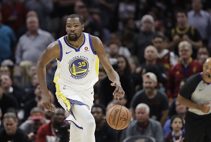 Golden State Warriors' Kevin Durant dribbles in the first half of Game 3 of basketball's NBA Finals against the Cleveland Cavaliers, Wednesday, June 6, 2018, in Cleveland. (AP Photo/Tony Dejak)