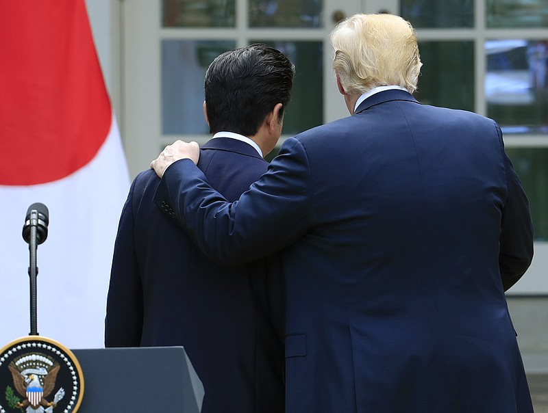 President Donald Trump, right, and Japanese Prime Minister Shinzo Abe walk back towards the Oval Office following a news conference in the Rose Garden at the White House in Washington, Thursday, June 7, 2018. (AP Photo/Manuel Balce Ceneta)