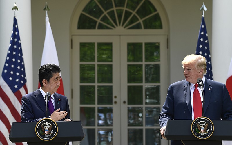 President Donald Trump, right, listens as Japanese Prime Minister Shinzo Abe, left, speaks during a news conference in the Rose Garden of the White House in Washington, Thursday, June 7, 2018. (AP Photo/Susan Walsh)