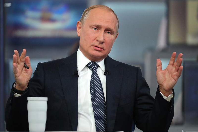 
              Russian President Vladimir Putin gestures answers a question during his annual call-in show in Moscow, Russia, Thursday, June 7, 2018. Putin hosts call-in shows every year, which typically provide a platform for ordinary Russians to appeal to the president on issues ranging from foreign policy to housing and utilities. (Mikhail Klimentyev, Sputnik, Kremlin Pool Photo via AP)
            