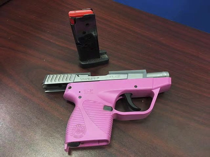 This update handout photo released Thursday, June 7, 2018, by the Transportation Security Administration shows a handgun that was one of 30 guns confiscated in May 2018 at Hartsfield Jackson Atlanta International Airport security check points. The 30 guns found in May set a new record for most guns discovered at a single airport nationwide in a single month. (TSA via AP)
