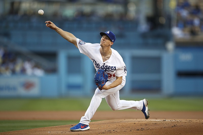 
              Los Angeles Dodgers starting pitcher Walker Buehler throws against the Atlanta Braves during the first inning of a baseball game, Friday, June 8, 2018, in Los Angeles. (AP Photo/Jae C. Hong)
            