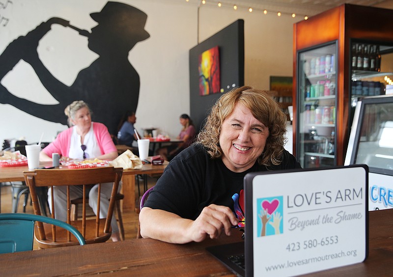 Mimi Nikkel poses for a photo Friday, June 1, 2018 at The Spot in Chattanooga, Tenn. Nikkel is the executive director at Love's Arm Outreach Ministries and has raised more than $148,000 to purchase a home for women who want help transitioning out of prostitution and addiction. 