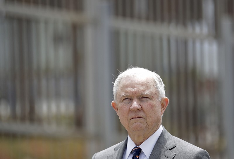 In this May 7, 2018, file photo, Attorney General Jeff Sessions listens during a news conference in San Diego near the border with Tijuana, Mexico.