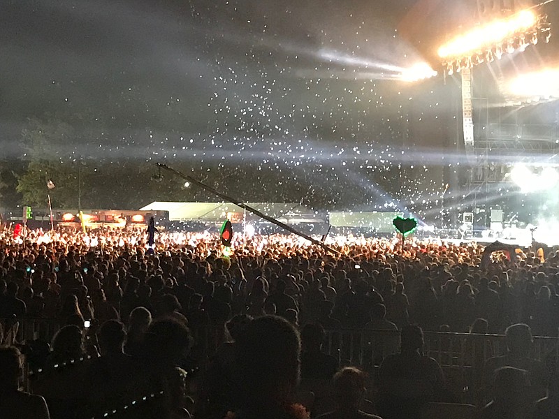 Confetti and streamers fly over the huge crowd at the Muse show on the What Stage Friday night at Bonnaroo.