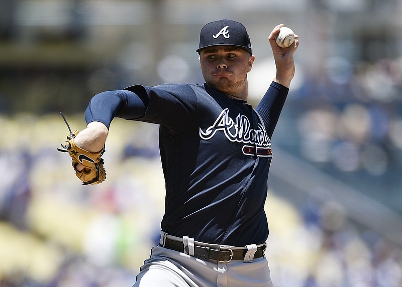 Atlanta Braves starting pitcher Sean Newcomb pitches to Los Angeles Dodgers' Chris Taylor during the first inning of a baseball game in Los Angeles, Sunday, June 10, 2018. (AP Photo/Kelvin Kuo)