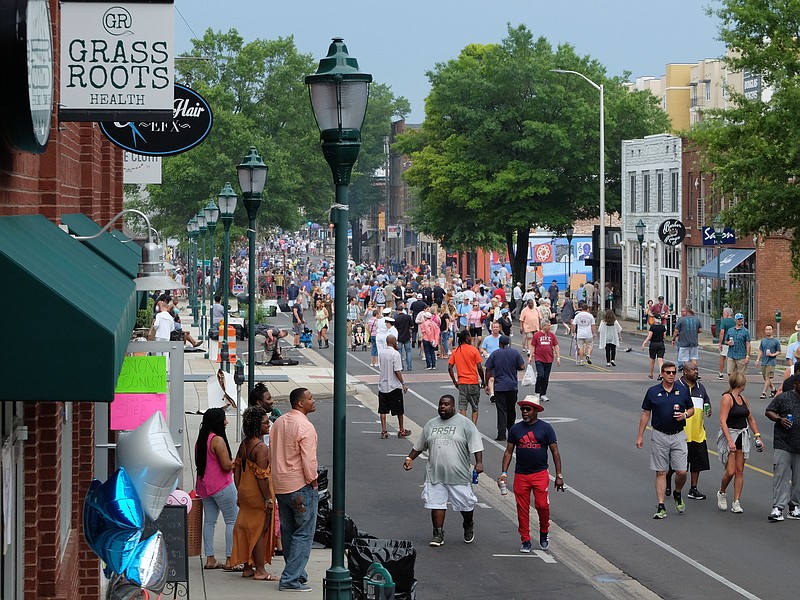 Staff photo by Tim Barber /
On the fourth night of the Riverbend Festival, hundreds crowd the street during the Bessie Smith Strut Monday night.