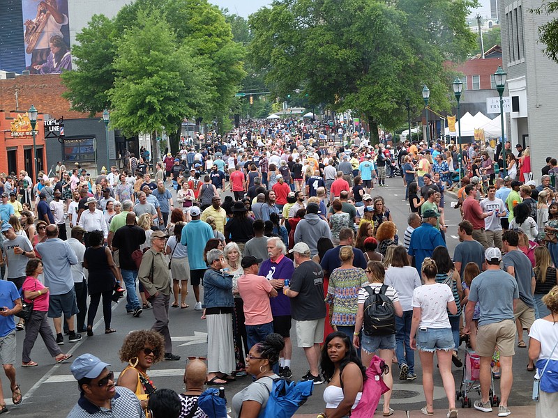 Staff photo by Tim Barber /
On the fourth night of the Riverbend Festival, hundreds crowd the street during the Bessie Smith Strut Monday night.