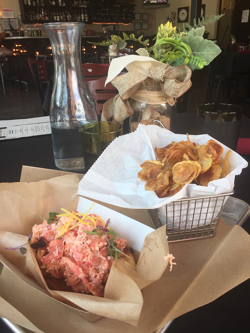 The Lobstah Roll at Wine Down is piled high with fresh lobster flown in from Maine and served with a basket of bite-size fingerling potato chips.