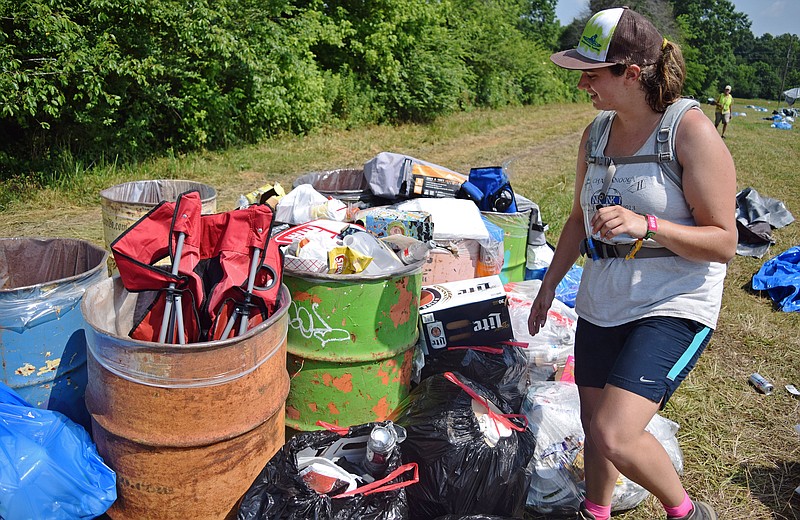 Mark Pace/Chattanooga Times Free Press —Cierra Paulson rummages through trash following the Bonnaroo music festival. A crew of volunteers helped collect used gear from the festival Monday to sell in the Gear Closet's annual sale taking place today from 10 a.m.-6 p.m.