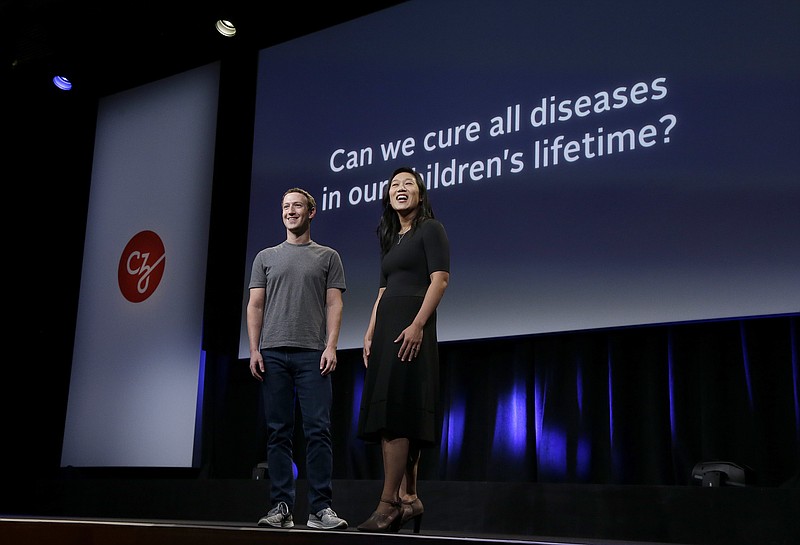 FILE- In this Sept. 20, 2016, file photo, Facebook CEO Mark Zuckerberg and his wife, Priscilla Chan, prepare for a speech in San Francisco. The Giving USA report, released Tuesday, June 12, 2018, said giving from individuals, estates, foundations and corporations reached an estimated $410 billion in 2017. The biggest increase was in giving to foundations, up 15.5 percent. This surge was driven by large gifts by major philanthropists to their own foundations, including $2 billion from Zuckerberg and Chan. (AP Photo/Jeff Chiu, File)